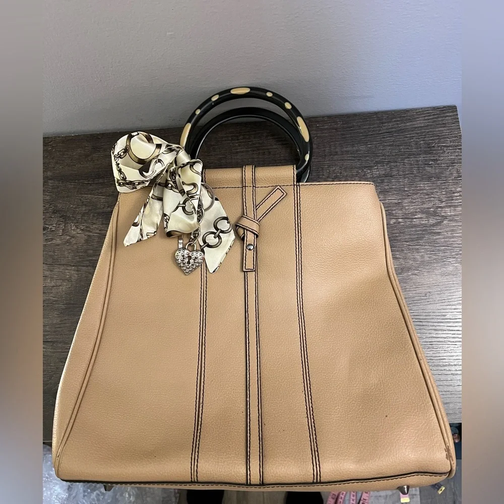 Tan leather tote with acrylic handles by Christine deGennaro